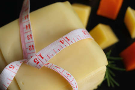 Piece and slices of cheeseの写真素材