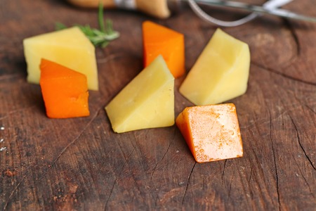 Piece and slices of cheeseの写真素材