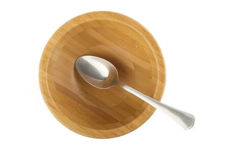 bamboo bowl with steel spoon isolated on whiteの写真素材
