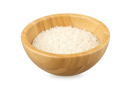 bowl partially filled with raw rice isolated on whiteの写真素材