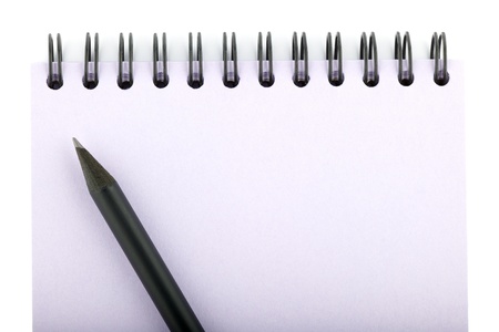 notebook and pencil isolated on a white backgroundの写真素材