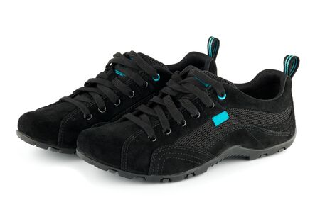 pair of black sport shoes isolated on whiteの写真素材