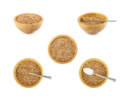 bamboo bowl and steel spoon with buckwheat set isolated on whiteの写真素材