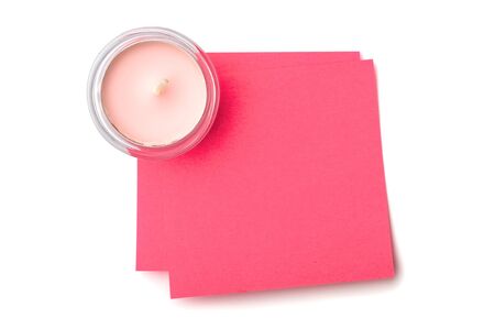 candle and sticky note isolated on whiteの写真素材