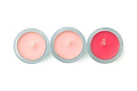 three pink candles isolated on white backgroundの写真素材