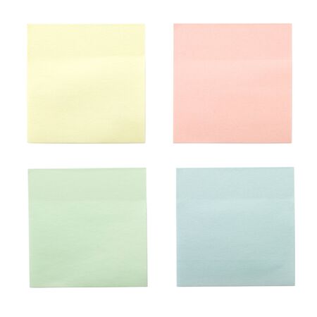 four colored sticky notes isolated on white backgroundの写真素材