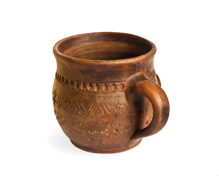 Ceramic cup with hand made ornament isolated on white backgroundの写真素材