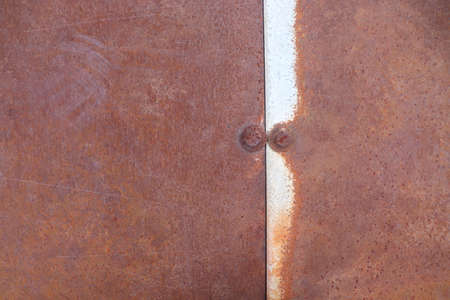 Rusty metal background. Rusty metal plate with rust and corrosion.の写真素材