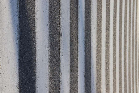 Close-up of a gray corrugated surface with black stripesの写真素材