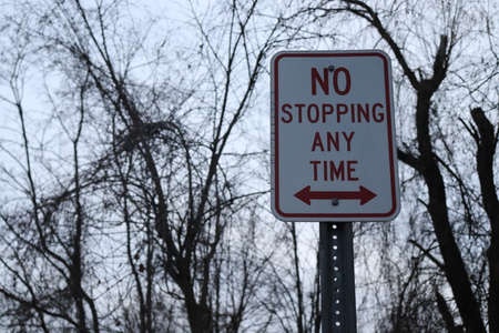 No stopping at any time sign on a road in the park.の写真素材