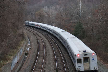 Train on a railroad in the mountains. View from the train window.の写真素材