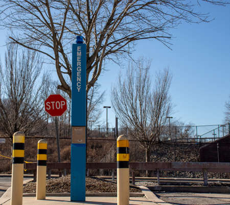 A vertical shot of a signpost with a stop sign on itの写真素材