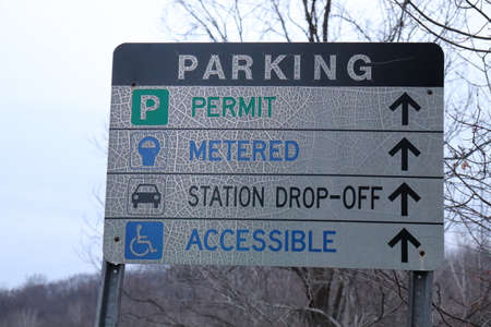 Parking lot sign on the road in the park in winter.の写真素材