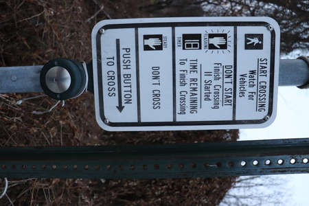 Signs on the side of a bridge in the winter forest.の写真素材
