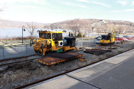 A construction machine works on a railroad trackの写真素材