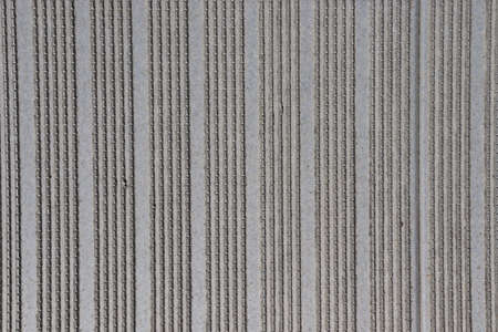 Close-up of gray corrugated cardboard texture useful as a backgroundの写真素材