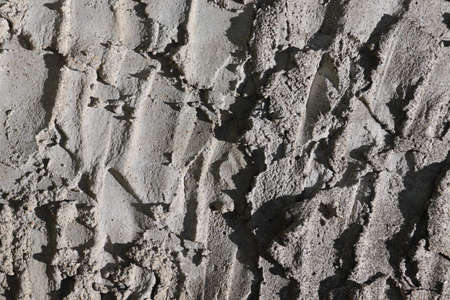 Texture of old gray concrete wall with cracks. Abstract background for design.の写真素材