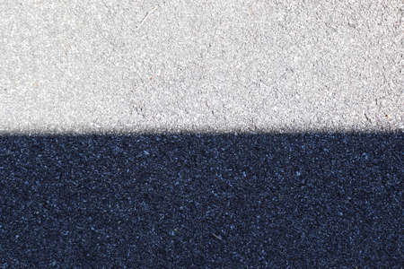 Asphalt texture background with white and blue lines. Top view.の写真素材