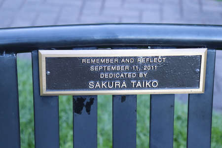 Sign on a metal fence in the park. The inscription is written in English.の写真素材