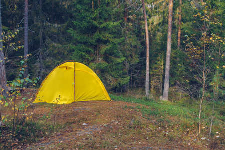 Camping tent in forest. Tourism concept, outdoors leisure. Life in a tent. Karelia, Russia.の写真素材