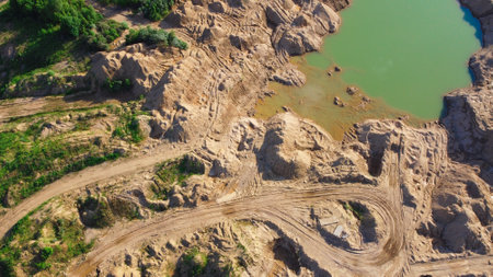 Flooded sand quarry. Place where dirt bikes ride and leave traces. Landscape for extreme quadricycles activities. Sychevo mines. Volokolamsk district of Moscow region. Russiaの写真素材