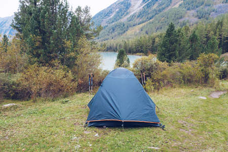 Camping tent in forest. Tourism concept, outdoors leisure. Life in a tent. Karelia, Russia.