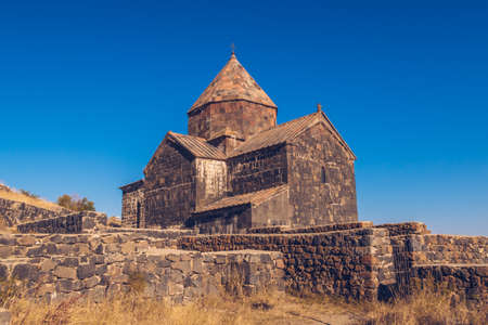 Scenic view of an old Sevanavank church in Sevan. Blue sky and bright autum colors on the sunny day. ancient temple stock photo.の写真素材
