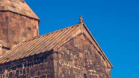 Closeup view of an old Sevanavank church in Sevan. Blue sky and bright autum colors on the sunny...