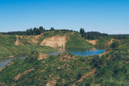 Lush greenery and picturesque blue lakes summer landscape for outdoors vacation, hiking, camping or...