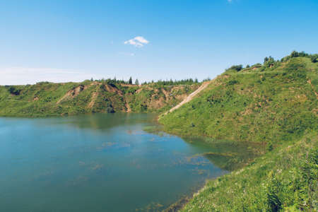Lush greenery and picturesque blue lakes summer landscape for outdoors vacation, hiking, camping or...