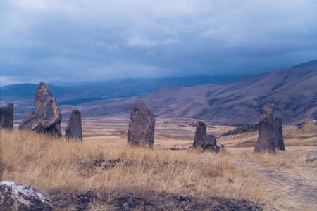Megalithic standing stones and burial mound of Zorats Karer or Carahunge - prehistoric monument in Armenia. Armenian Stonehenge stock photoの写真素材