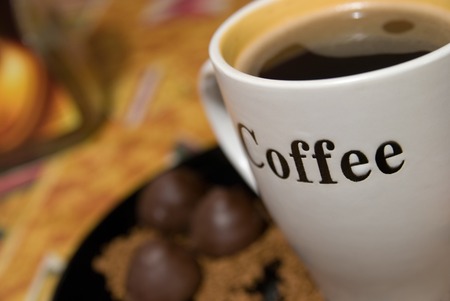 Cup of coffee and chocolate sweetsの写真素材