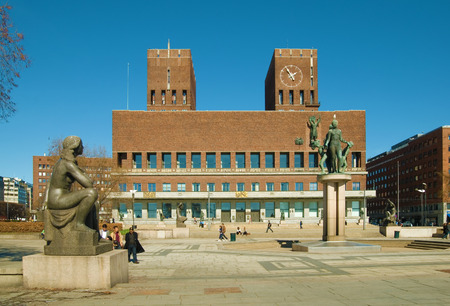 People walk near the Town Hall. Oslo. Norway. April 12th, 2010のeditorial素材
