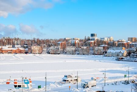 LAPPEENRANTA, FINLAND - FEBRUARY 18, 2010: Winter landscape with boats in Lappeenranta Harbor on Saima Lake. View from Linnoitus Fortress.のeditorial素材