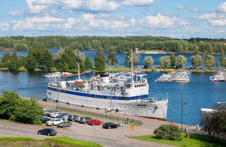 LAPPEENRANTA, FINLAND - AUGUST 8, 2016: Summer landscape with white boat in Lappeenranta Harbor on Saimaa Lake. View from Linnoitus Fortressのeditorial素材