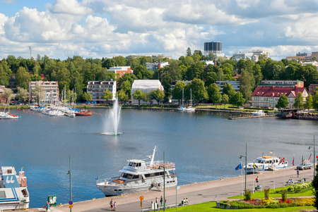 LAPPEENRANTA, FINLAND - AUGUST 8, 2016: Summer landscape with fountain and boats in Lappeenranta Harbor on Saimaa Lake.のeditorial素材