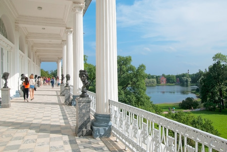 TSARSKOYE SELO, SAINT - PETERSBURG, RUSSIA - JULY 25, 2016: The Cameron Gallery. The bronze busts of the Antique deities, heroes and great names of history. On the background is The Admiralty Pavilionのeditorial素材