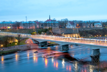 NARVA, ESTONIA - JANUARY 1, 2017: Bridge of Friendship with pedestrian tunnel over Narova River between Narva in Estonia and Ivangorod in Russia. Here is the border of two countries. View from Russiaのeditorial素材