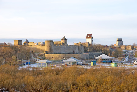 IVANGOROD, RUSSIA - JANUARY 3, 2017: View for Multilateral transport crossing point near Russian-Estonian border. On the background is Ivangorod Fortress and Hermann Castle in Narvaのeditorial素材