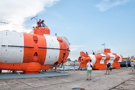 KRONSTADT, ST. PETERSBURG, RUSSIA - JULY 28, 2018: People near bathyscaphes in military historical park on the pier of Kronstadt town next to the gulfのeditorial素材
