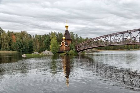 Vasilievo, Priozersky District, Leningrad Region, Russia - September 22, 2018: Orthodox temple of Andrew the Apostle (Andrey Pervozvanny) on the small stone island of Vuoksi Riverのeditorial素材