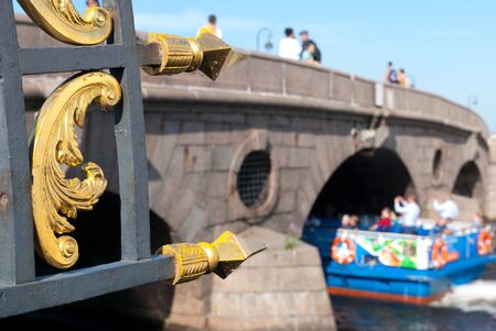 Saint-Petersburg, RussiaâAugust 28, 2019: People travel in excursion boat on The Fontanka River near The Pracheshny Bridge next to The Summer Gardenのeditorial素材