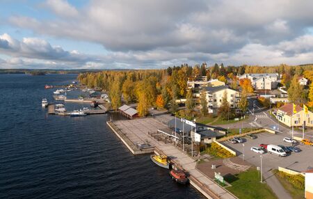 Puumala, FinlandâOctober 5, 2019: Top view of the townscape with the church and the boats on the bank of The Saimaa Lake. Puumala Municipality. Southern Savonia (Savo) Regionのeditorial素材