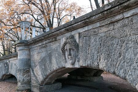 Tsarskoye Selo, Saint-Petersburg, Russia - October 15, 2019: The Ramp with the mask of the antic goddess in The Catherine Park near The Cameron Gallery. The Tsarskoye Selo is The State Museum-Preserveのeditorial素材