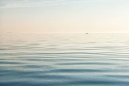 View of The Gulf of Finland (The Baltic Sea) with boat in foggy horizon. Saint-Petersburg. Russiaの写真素材