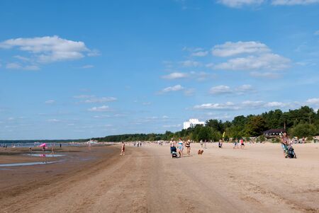 Sestroretsk, Saint-Petersburg, Russia â August 18, 2019: People relax on the sand beach of The Gulf of Finland not far from The Sestroretsk Kurort Sanatoriumのeditorial素材