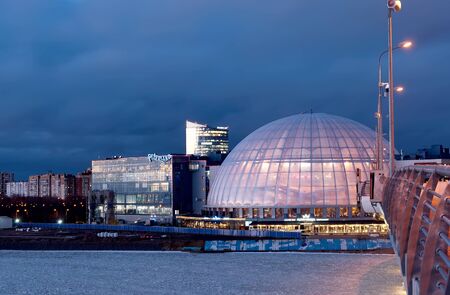 Saint-Petersburg, Russia-December 9, 2019: Night view of the coast of The Gulf of Finland, Piterland Complex and cupola of aquapark from The Yacht Bridgeのeditorial素材