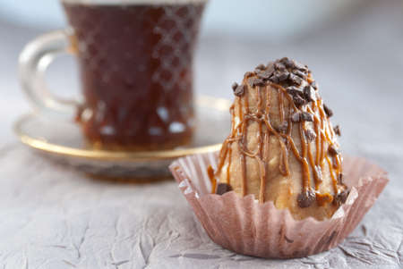 Cake and a glass cup of coffee on the table. Close up imageの写真素材