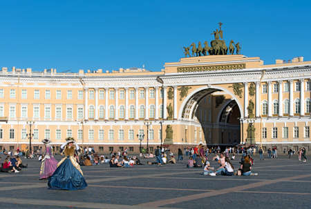 Saint-Petersburg, Russia â June 13, 2020: People sit on the cobblestone pavement of The Palace Square near The General Staff Buildingのeditorial素材