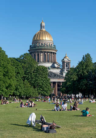 Saint-Petersburg, Russia â June 13, 2020: Many people lie and rest on the grass near Saint Isaac Cathedral in the center of the cityのeditorial素材